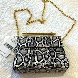 Mini Muse black and white snake tote with a removable cross body chain.